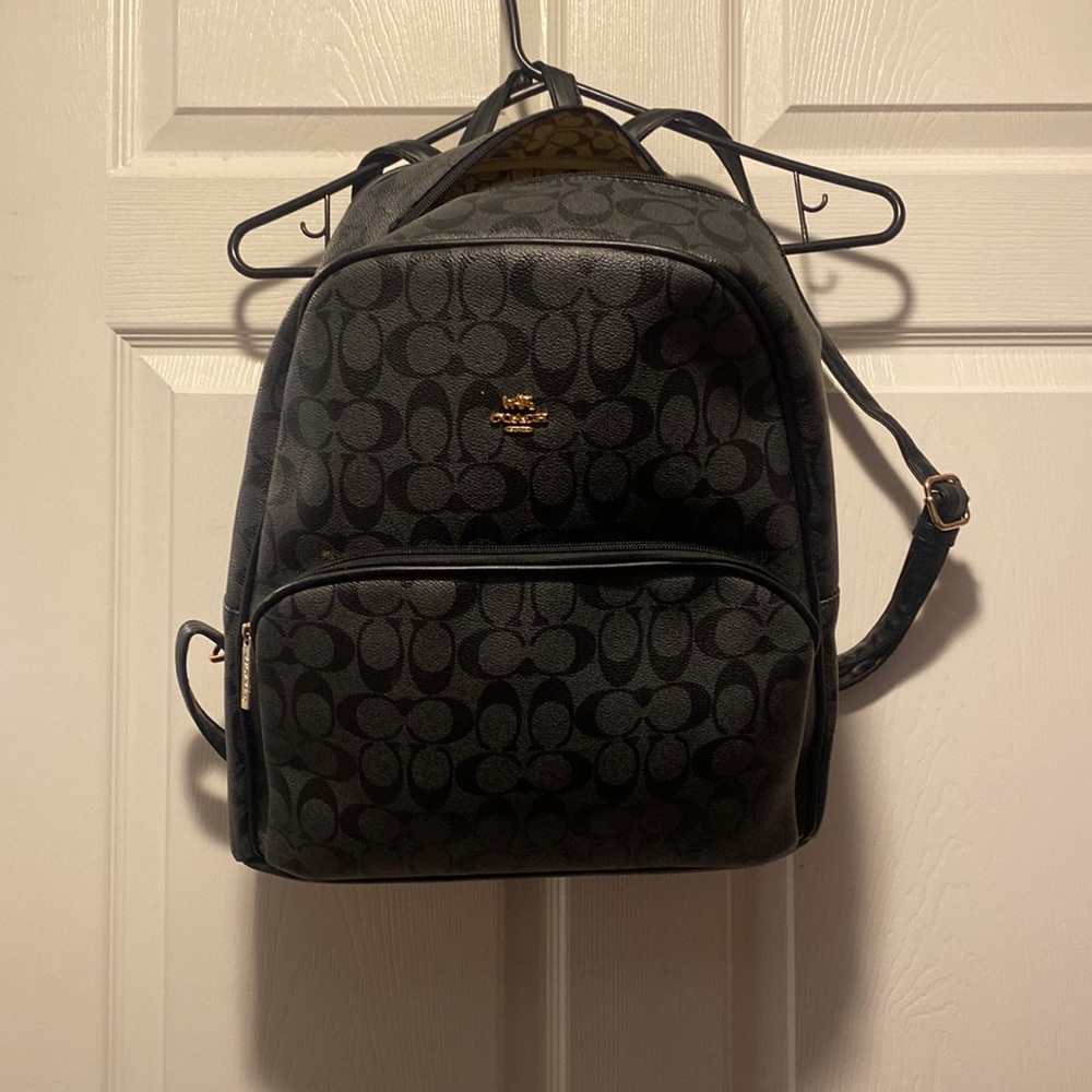 Good size black coach bag with gold decals